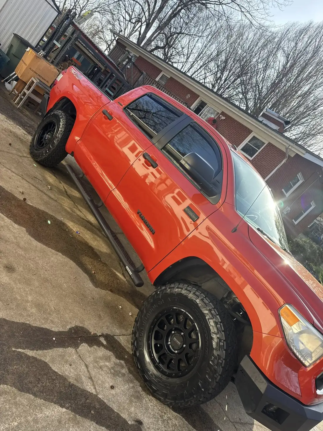 Orange Toyota Tundra TRD with ceramic coating gloss after detailing by Joey's Precision Detailing